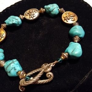 Turquoise toggle bracelet adorned w/ fluer-di-lis